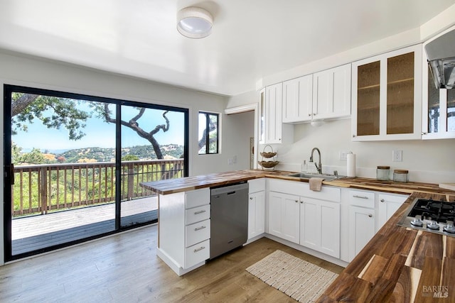 76 Oak Springs Dr, San Anselmo, CA 94960 - kitchen featuring wood counters, stainless steel appliances, a peninsula, glass insert cabinets, and white cabinets