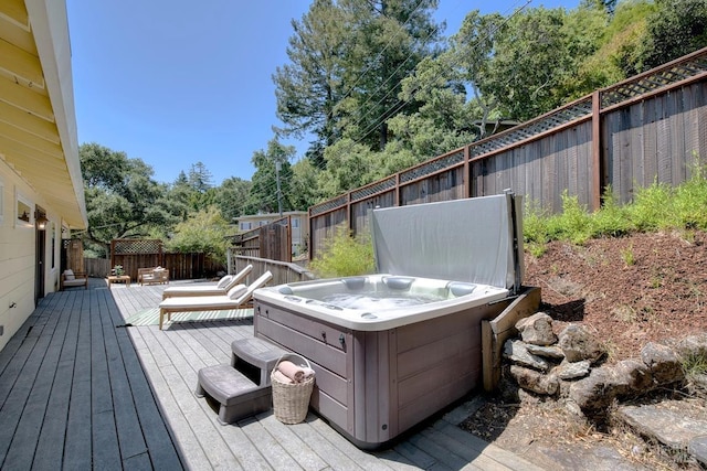 76 Oak Springs Dr, San Anselmo, CA 94960 - deck featuring a hot tub, a fenced backyard, and view of wooded area