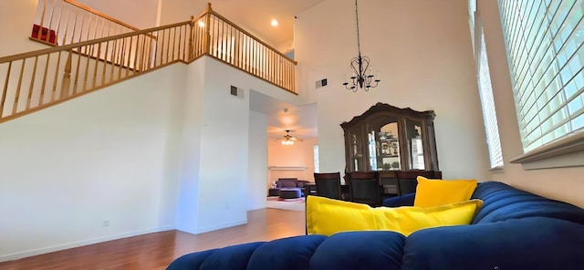6 SE Tahoe View Ct, Sacramento, CA 95835 - living area featuring a high ceiling, wood finished floors, a chandelier, and a ceiling fan