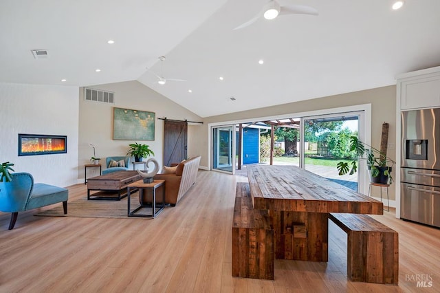 5648 Ver Ni Rd, Sebastopol, CA 95472 - living area featuring a ceiling fan, a barn door, light wood-type flooring, and high vaulted ceiling