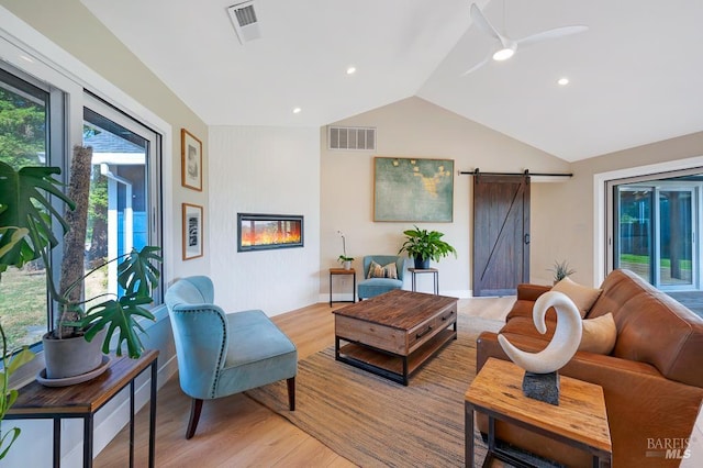 5648 Ver Ni Rd, Sebastopol, CA 95472 - living area featuring a barn door, lofted ceiling, light wood-type flooring, and ceiling fan