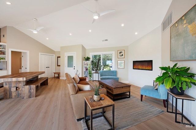 5648 Ver Ni Rd, Sebastopol, CA 95472 - living room with a ceiling fan, light wood-type flooring, high vaulted ceiling, a fireplace, and recessed lighting