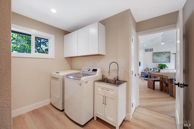 5648 Ver Ni Rd, Sebastopol, CA 95472 - washroom featuring washer and dryer, light wood finished floors, cabinet space, and recessed lighting
