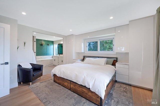 5648 Ver Ni Rd, Sebastopol, CA 95472 - bedroom with light wood finished floors, recessed lighting, and ensuite bathroom