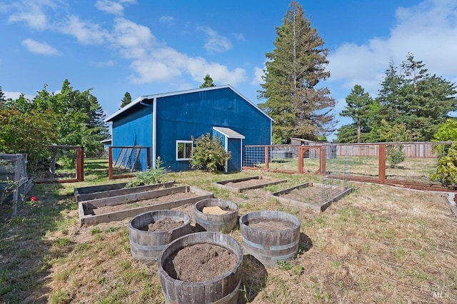 5648 Ver Ni Rd, Sebastopol, CA 95472 - view of yard with a vegetable garden, an outdoor structure, and an outbuilding