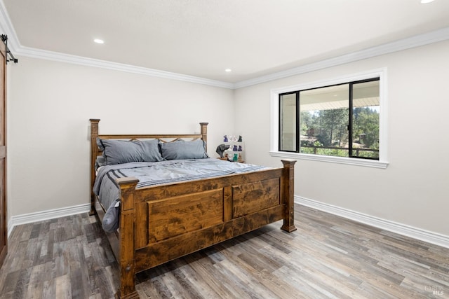 875 White Cottage Rd N, Angwin, CA 94508 - bedroom with wood finished floors, crown molding, recessed lighting, and a barn door