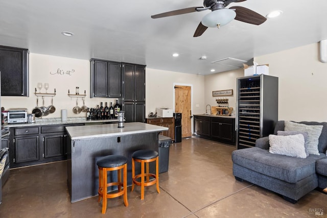 875 White Cottage Rd N, Angwin, CA 94508 - kitchen featuring wine cooler, concrete flooring, open floor plan, light countertops, and ceiling fan