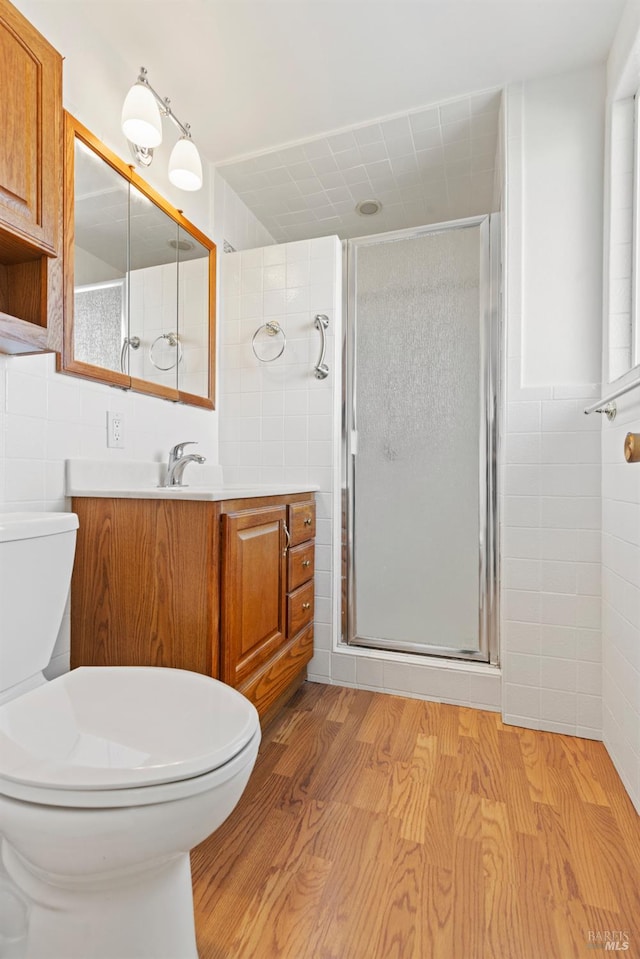 437 Ely Blvd S, Petaluma, CA 94954 - bathroom with tile walls, wood finished floors, a stall shower, and vanity