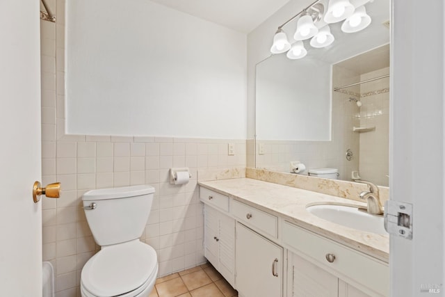 437 Ely Blvd S, Petaluma, CA 94954 - bathroom featuring tile walls, vanity, tiled shower, a wainscoted wall, and tile patterned flooring