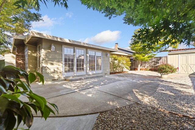 437 Ely Blvd S, Petaluma, CA 94954 - rear view of house with a patio area, a shed, and a fenced backyard
