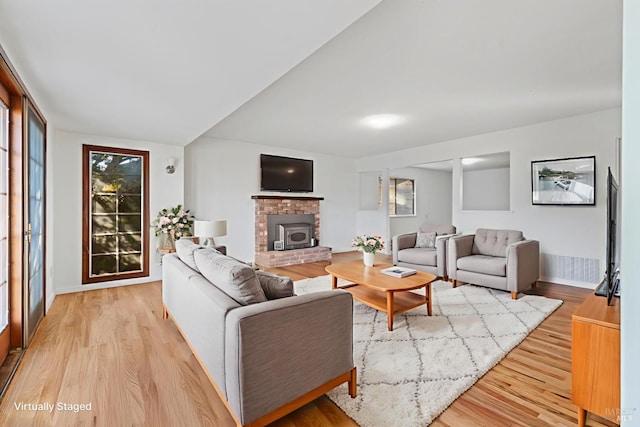 437 Ely Blvd S, Petaluma, CA 94954 - living area featuring light wood-style flooring and a fireplace