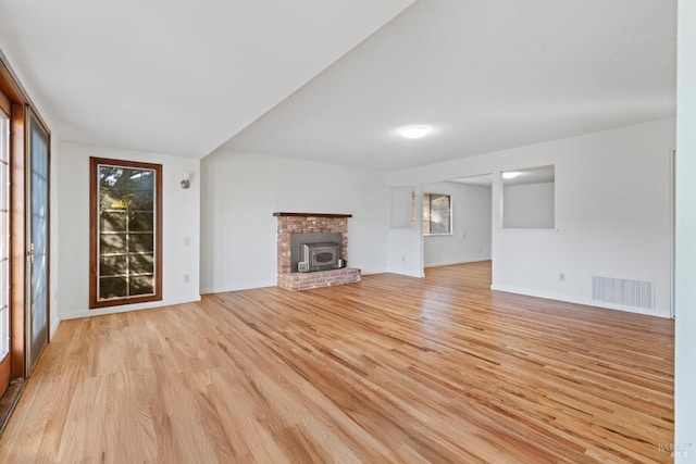 437 Ely Blvd S, Petaluma, CA 94954 - unfurnished living room with light wood-type flooring and a brick fireplace