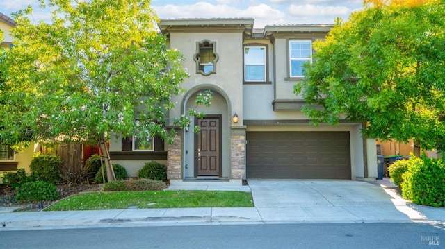 5041 Soprano Cir, Fairfield, CA 94534 - view of front of property featuring stucco siding, a garage, concrete driveway, and stone siding