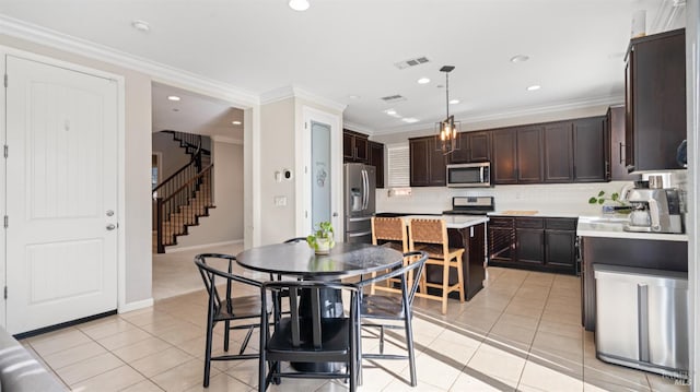 5041 Soprano Cir, Fairfield, CA 94534 - dining area with light tile patterned floors, stairway, crown molding, and recessed lighting