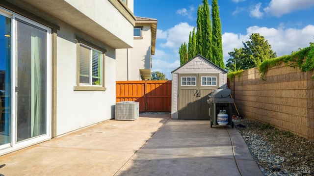 5041 Soprano Cir, Fairfield, CA 94534 - fenced backyard featuring a patio area, a storage shed, and a grill