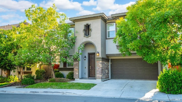 5041 Soprano Cir, Fairfield, CA 94534 - view of front of home with stucco siding, driveway, stone siding, and a garage