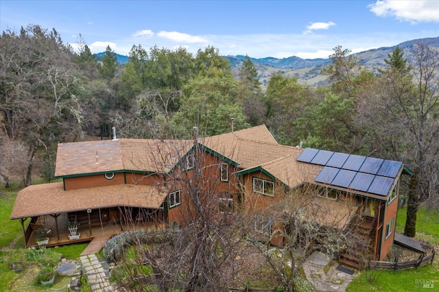 3100 Radical Ridge Rd, Redwood Valley, CA 95470 - rear view of property featuring solar panels, a porch, and a mountain view