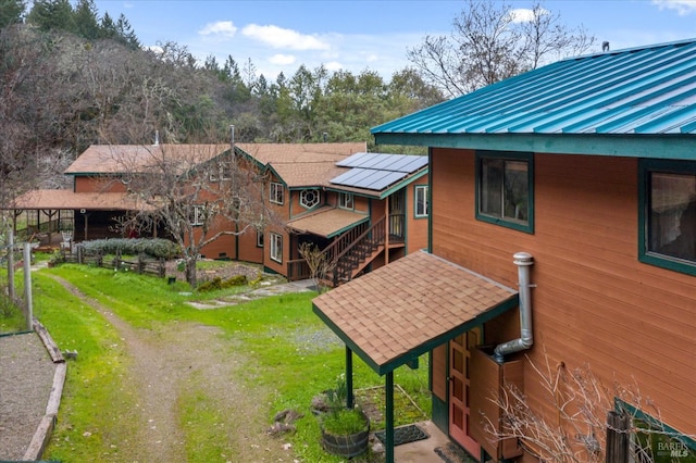 3100 Radical Ridge Rd, Redwood Valley, CA 95470 - rear view of house featuring a metal roof, a standing seam roof, and a lawn
