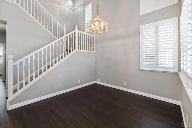 831 Bluewater Dr, Vacaville, CA 95688 - stairway with a chandelier, wood finished floors, and plenty of natural light