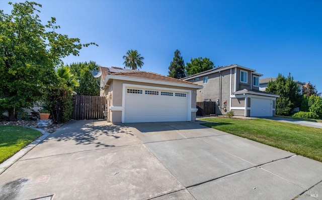 831 Bluewater Dr, Vacaville, CA 95688 - view of front facade featuring stucco siding, a tiled roof, a garage, and roof mounted solar panels