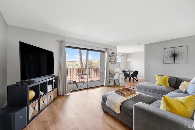 900 Cambridge Dr Unit 77, Benicia, CA 94510 - living room with light wood-style flooring and a chandelier