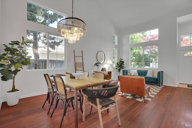 494 Mccall Dr, Benicia, CA 94510 - dining space with a high ceiling, wood finished floors, and a chandelier