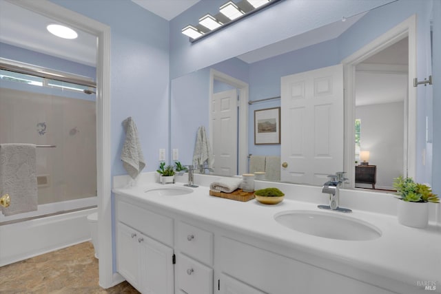 494 Mccall Dr, Benicia, CA 94510 - full bathroom with double vanity, enclosed tub / shower combo, healthy amount of natural light, and stone finish flooring