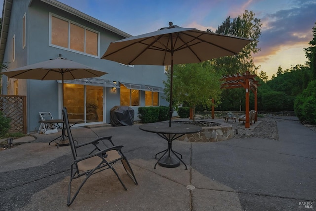 494 Mccall Dr, Benicia, CA 94510 - patio terrace at dusk featuring area for grilling, a fire pit, a patio area, and a pergola
