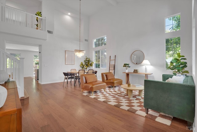 494 Mccall Dr, Benicia, CA 94510 - living area featuring a high ceiling, wood finished floors, and stairway