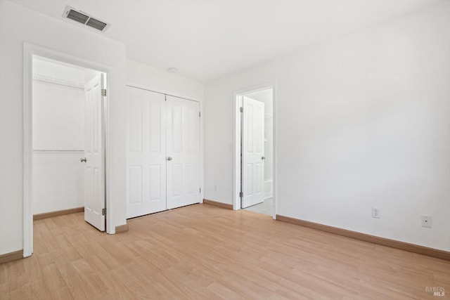 1125 Brighton View Cir, Petaluma, CA 94952 - unfurnished bedroom featuring light wood-type flooring, multiple closets, and connected bathroom