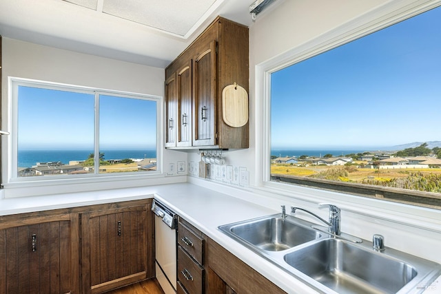 359 Terra Verde, Bodega Bay, CA 94923 - kitchen with dishwasher, light countertops, and dark brown cabinetry