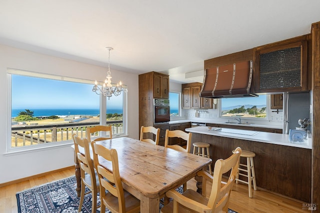 359 Terra Verde, Bodega Bay, CA 94923 - dining space featuring a chandelier and light wood-type flooring