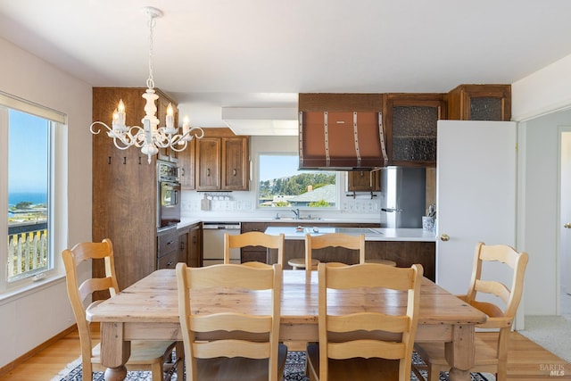 359 Terra Verde, Bodega Bay, CA 94923 - dining area with healthy amount of natural light and a chandelier