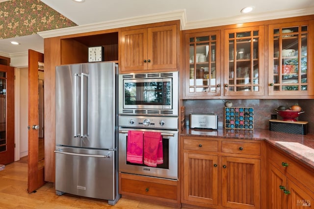 1300 Ink Grade Rd, Pope Valley, CA 94567 - kitchen with stainless steel appliances, stone counters, brown cabinetry, glass insert cabinets, and backsplash
