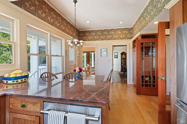 1300 Ink Grade Rd, Pope Valley, CA 94567 - kitchen featuring light wood-type flooring, crown molding, a chandelier, freestanding refrigerator, and dark stone counters