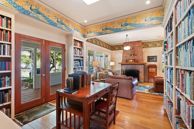 1300 Ink Grade Rd, Pope Valley, CA 94567 - dining space with light wood finished floors, crown molding, healthy amount of natural light, a fireplace, and built in features