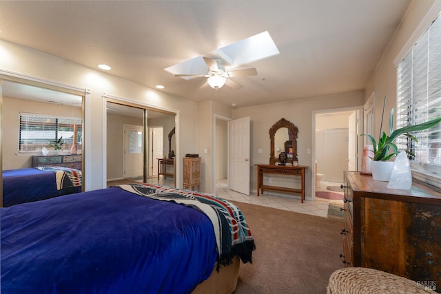1851 Daniel Way, Redwood Valley, CA 95470 - bedroom featuring a skylight, light tile patterned floors, recessed lighting, a ceiling fan, and connected bathroom