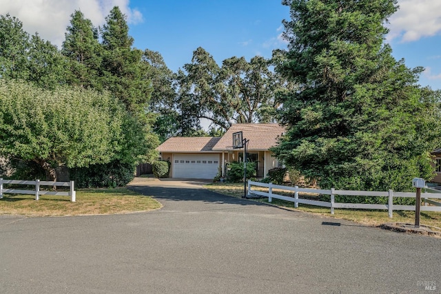 1851 Daniel Way, Redwood Valley, CA 95470 - view of property hidden behind natural elements with driveway and an attached garage