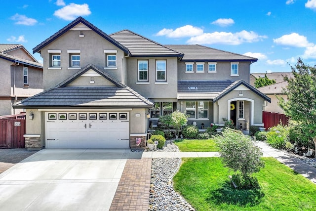 644 Canterbury Cir, Vacaville, CA 95687 - traditional home featuring stucco siding, concrete driveway, a tile roof, and an attached garage
