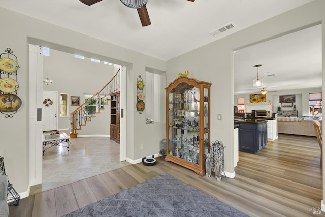 644 Canterbury Cir, Vacaville, CA 95687 - entryway featuring ceiling fan, stairway, and light wood-type flooring
