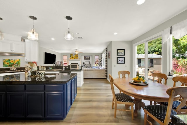 644 Canterbury Cir, Vacaville, CA 95687 - kitchen featuring light wood finished floors, white cabinets, blue cabinetry, recessed lighting, and a ceiling fan