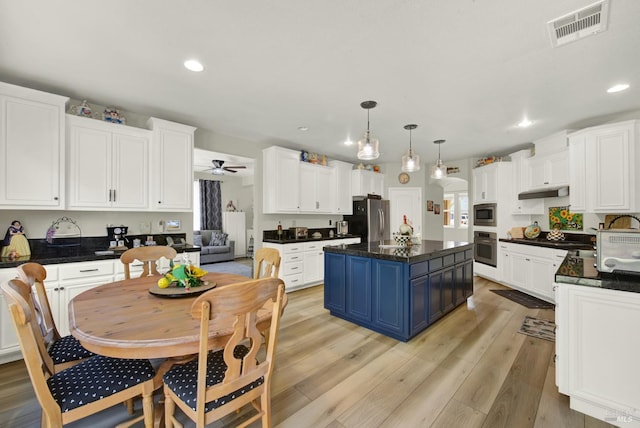 644 Canterbury Cir, Vacaville, CA 95687 - kitchen featuring appliances with stainless steel finishes, blue cabinets, white cabinets, and recessed lighting