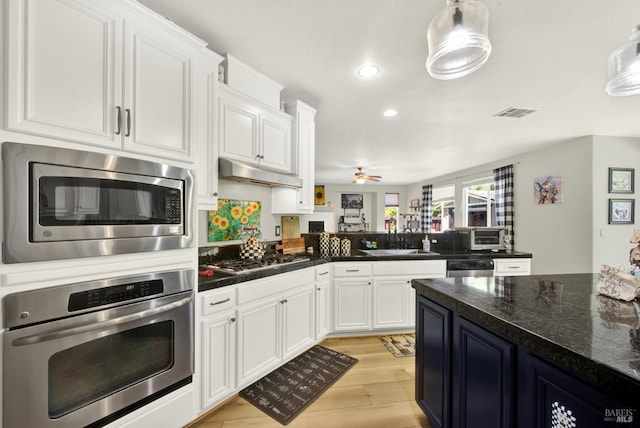 644 Canterbury Cir, Vacaville, CA 95687 - kitchen with appliances with stainless steel finishes, white cabinets, light wood-type flooring, a ceiling fan, and recessed lighting
