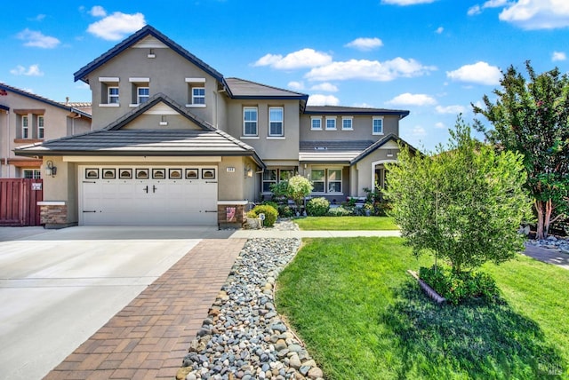 644 Canterbury Cir, Vacaville, CA 95687 - view of front of home with stucco siding, driveway, and a garage