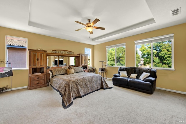 644 Canterbury Cir, Vacaville, CA 95687 - bedroom featuring a raised ceiling, light colored carpet, and a ceiling fan