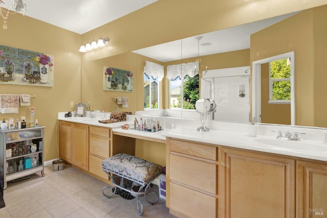 644 Canterbury Cir, Vacaville, CA 95687 - full bathroom with plenty of natural light, double vanity, tile patterned floors, and a stall shower