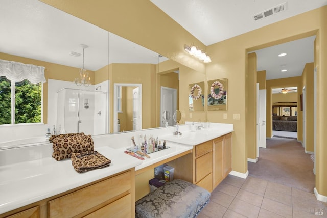 644 Canterbury Cir, Vacaville, CA 95687 - bathroom with a stall shower, tile patterned flooring, double vanity, and ceiling fan