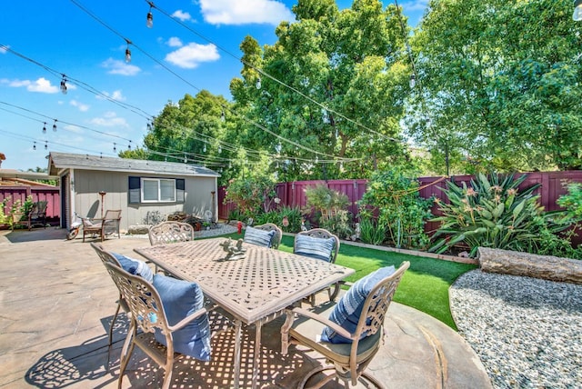 644 Canterbury Cir, Vacaville, CA 95687 - fenced backyard with a patio area, outdoor dining area, and an outbuilding