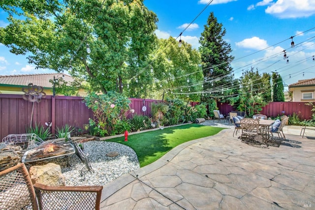 644 Canterbury Cir, Vacaville, CA 95687 - fenced backyard with an outdoor fire pit, a patio, and outdoor dining area