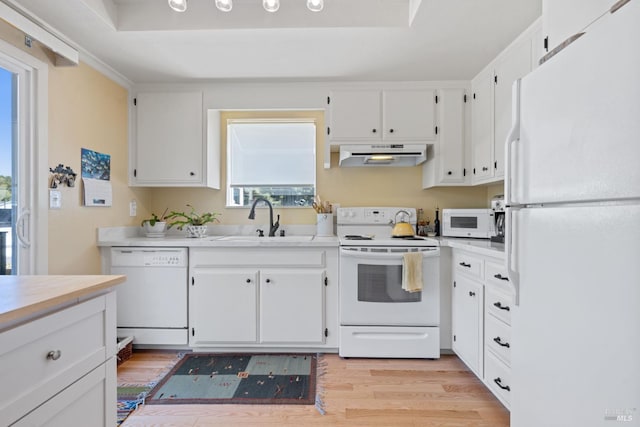 7771 Healdsburg Ave Unit 22, Sebastopol, CA 95472 - kitchen featuring white appliances, under cabinet range hood, light wood-style flooring, and light countertops